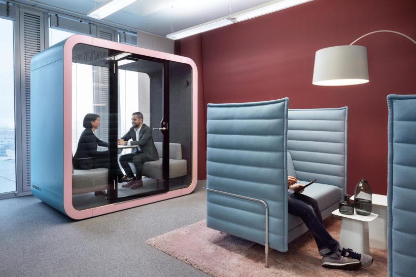 People sitting in Framery Q office pod at Colliers office