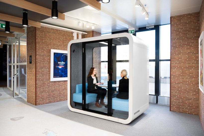 Two women discussing in the Framery Q office pod