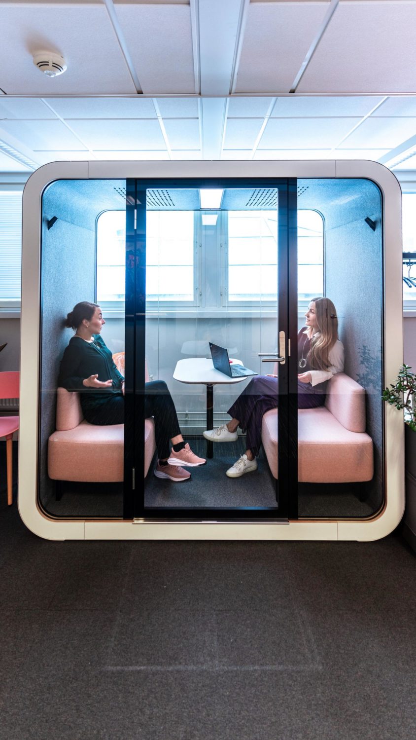 Women sitting in Framery Q soundproof meeting pod