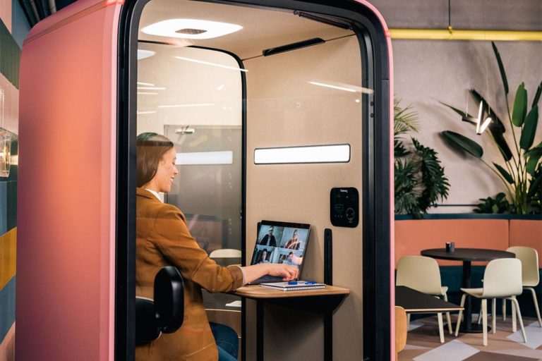 Woman using videoconferencing light in Framery One Office Pod