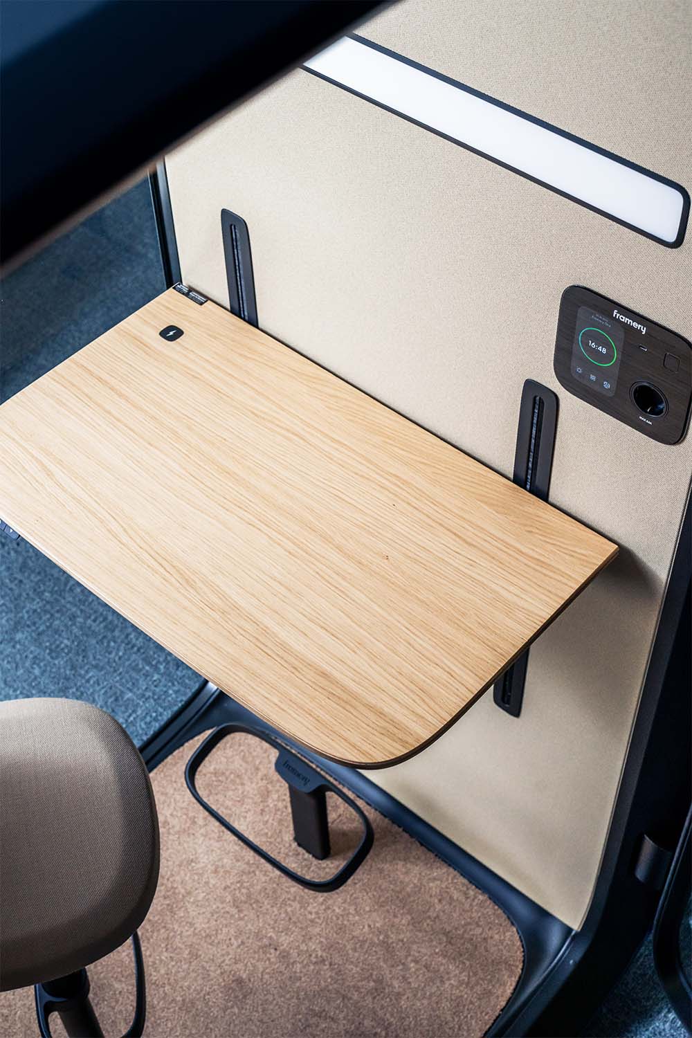 Framery One's adjustable table for increased comfort and better working ergonomic.