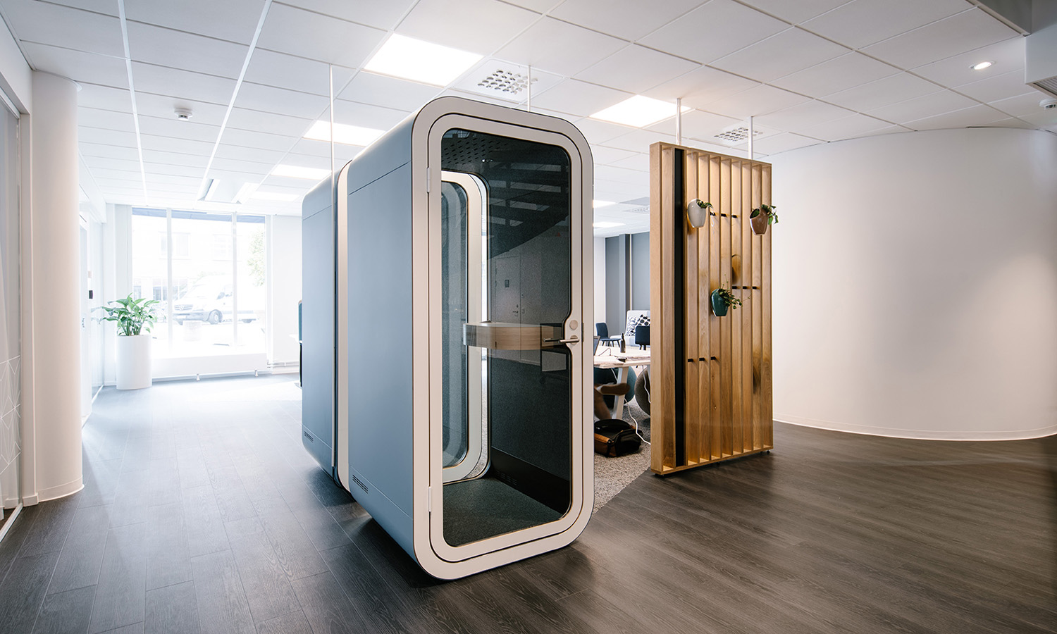 Framery O office phone booth in an open-plan office setting.
