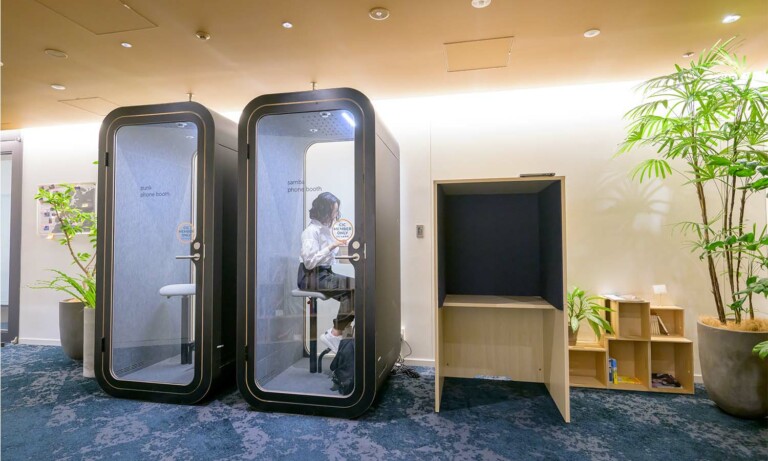 A person using Framery O as a privacy pod for an important phone call.