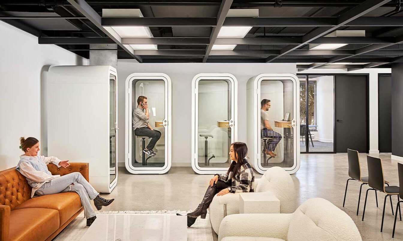 People working in Framery office pods in Hub 350 offices.