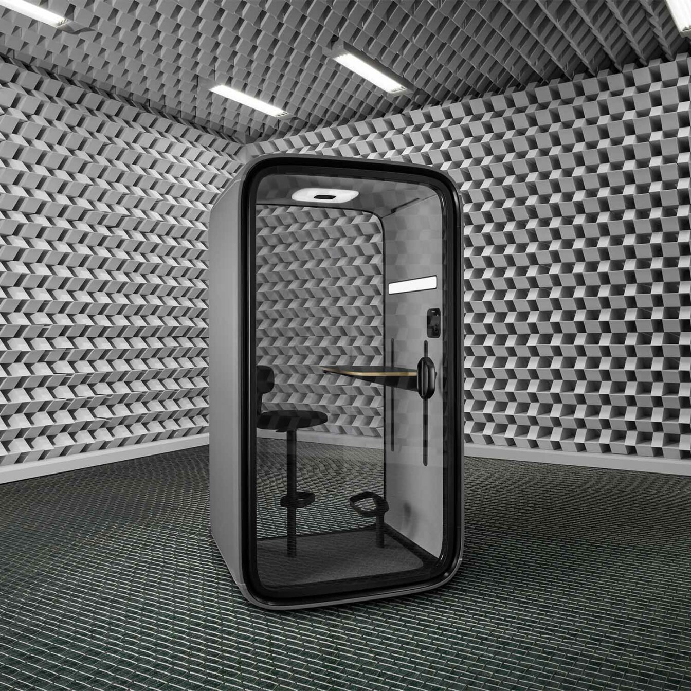 Framery One office pod in a grey, empty room.