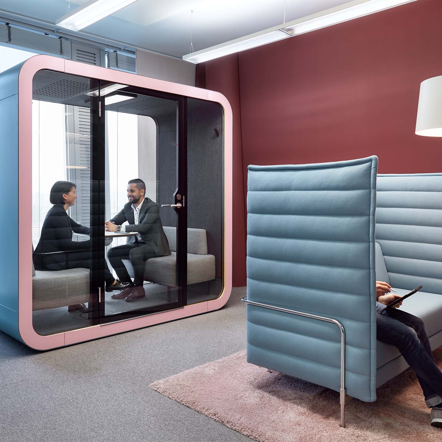 Two people having a meeting in a Framery Q meeting pod in Colliers office.
