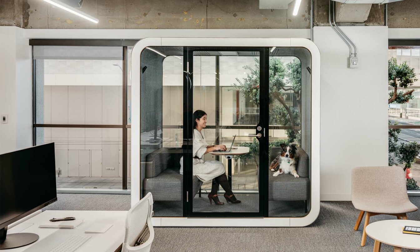 A person working in a soundproof Framery Q meeting pod,