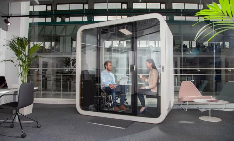 People having a meeting inside accessible Framery Q Flip n Fold meeting pod