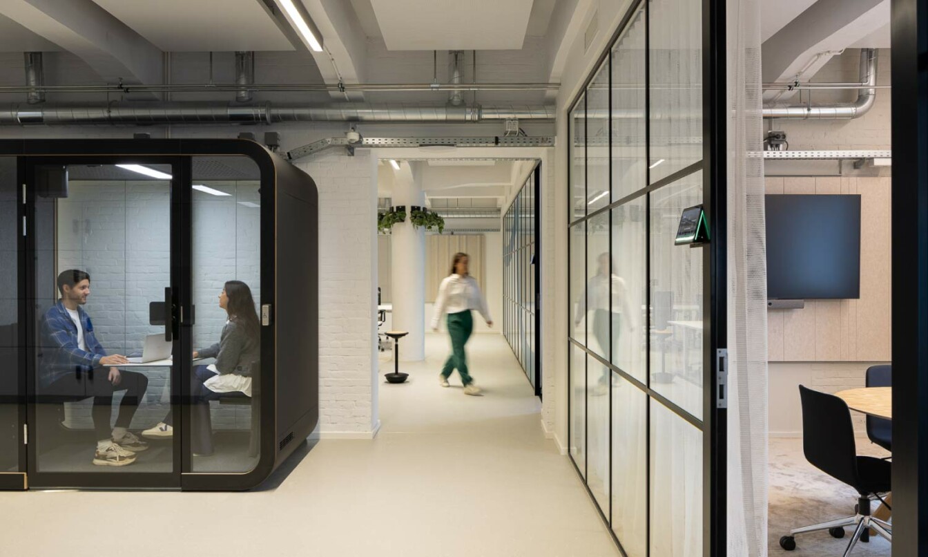 Black Framery Q Flin N' Fold soundproof office meeting pod in the Personio office, Amsterdam