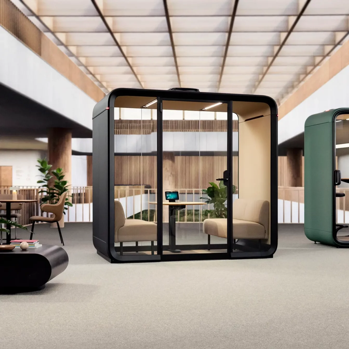 A smart meeting pod, Framery Four in an open plan office.