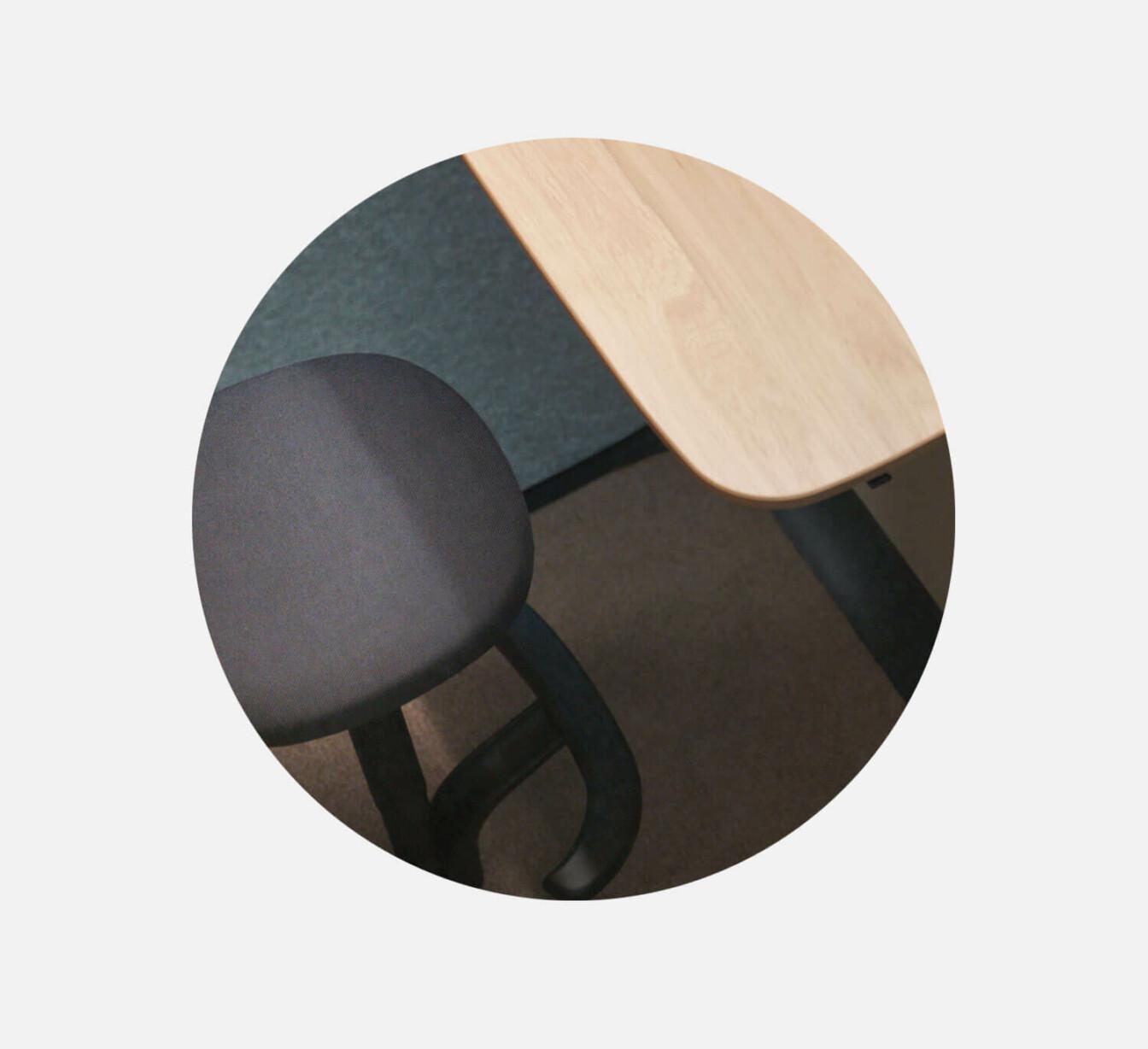 A detailed image of Framery One Compact's table and seat.